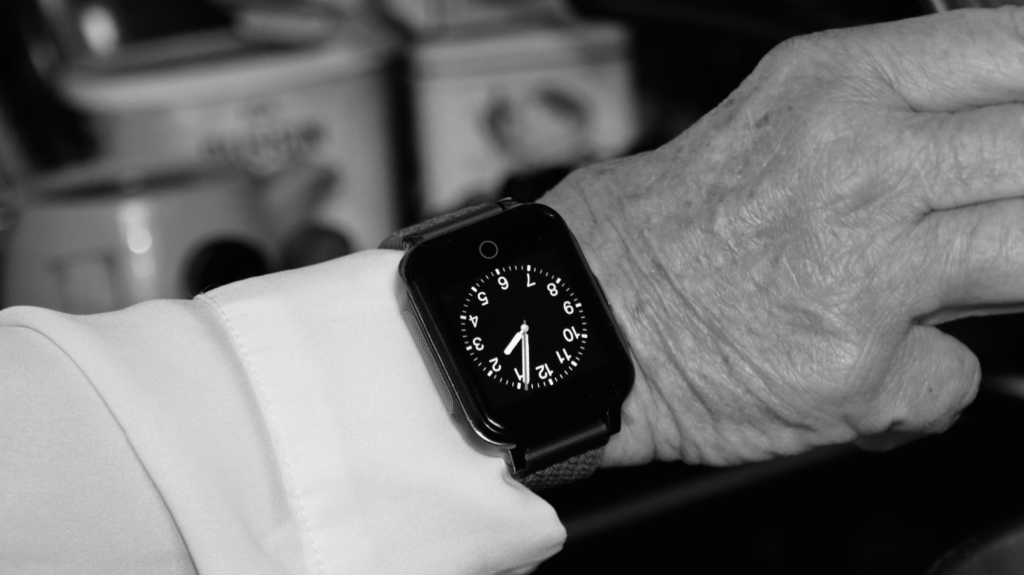 Sensorem's smart watch with security alarm and GPS increases security for seniors who live alone. Sensorem's alarm center is open 24/7. The alarm does not require home care. Picture of senior with security alarm